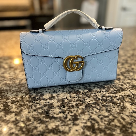 Light Blue Clutch with Gold Logo - Picture 1 of 2